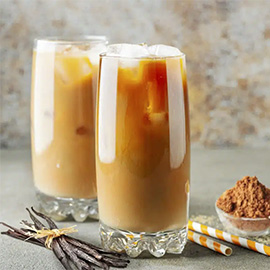 An iced rooibos latte in a tall glass