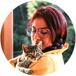 Customer profile image: Lauren Wright (female) with her childhood cat (mackerel tabby kitten)
